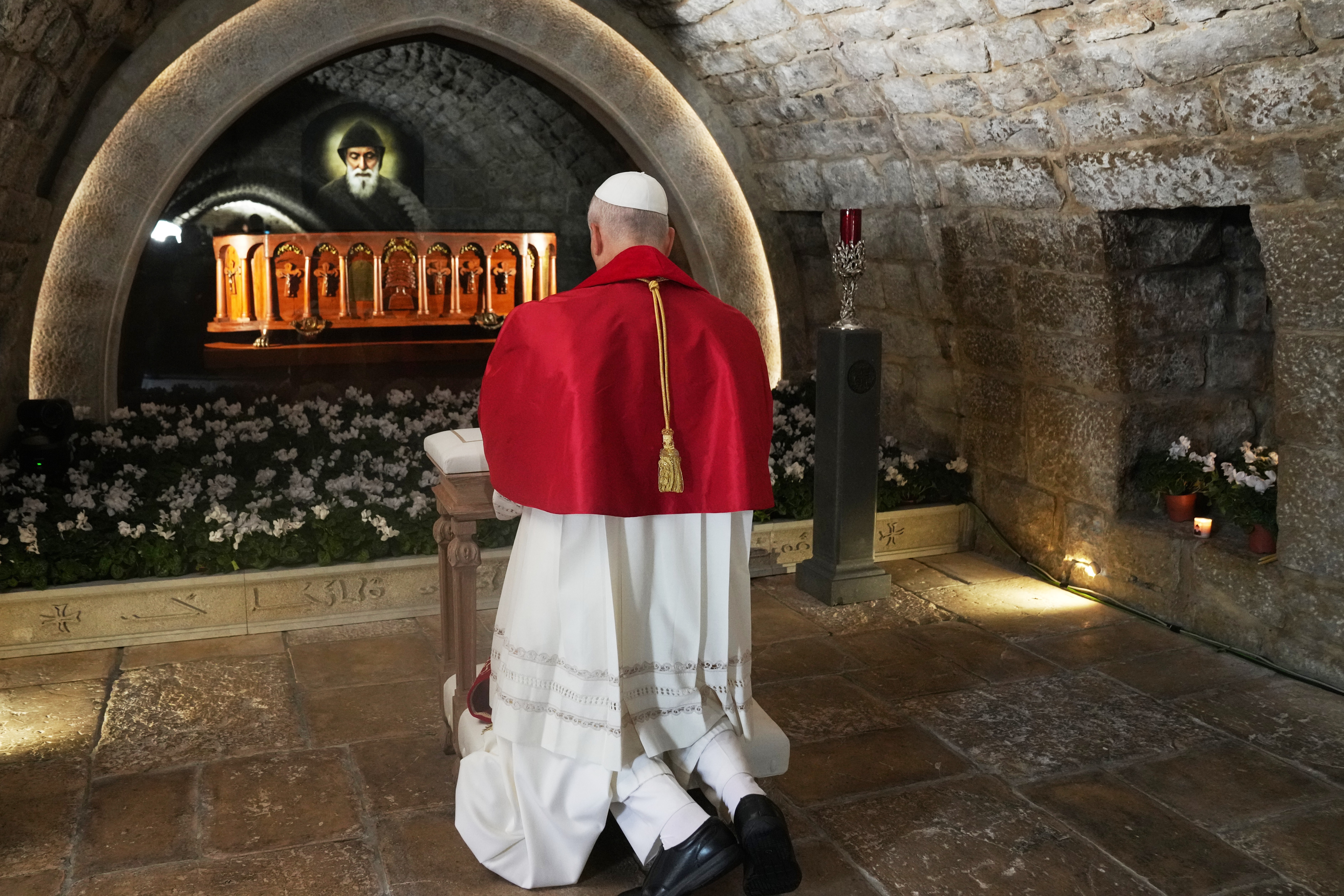 Pope Leo XIV prays in front of the tomb of Saint Charbel Makhlouf at the Monastery of Saint Maroun, in Annaya, Lebanon, Monday, Dec. 1, 2025.
